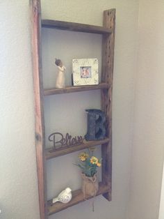 a wooden shelf with three shelves on it