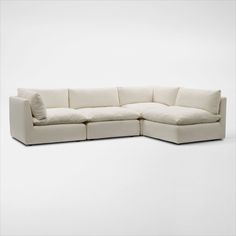 Pillowy soft with a modern style. The Lola 4-Piece Sectional and Ottoman Set elevates your space with minimalist detailing, cloud-like comfort and oversized seating you just want to burrow in. | Lola 4-Piece Sectional in Ivory | by Value City Furniture Cream Sectional, Sectional And Ottoman, Long Couch, White Sectional, American Signature Furniture, Value City Furniture, 3 Piece Sectional, Ottoman Set, City Furniture