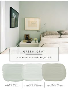 a bedroom with white walls and gray bedding in shades of green, grey, and light blue