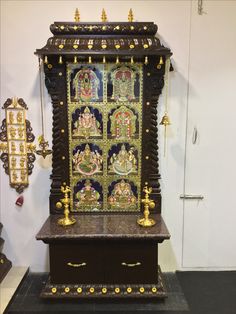 an ornate wooden cabinet with gold decorations on it