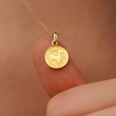 Our 14K Solid Gold Capricorn Necklace, with its coin-style pendant on a delicate chain, is the perfect blend of elegance and astrology. Symbolizing strength and ambition, it's a timeless gift for Capricorns or a personal treat. PRODUCT DETAILS: • Material: 14K Solid Gold (real solid gold, no gold-filled or no gold plated material) • Choice of Gold Color: Yellow Gold, Rose Gold, White Gold • Adjustable Length • Closure: Spring ring • Chain style: Cable • Style: Minimalist Capricorn Necklace, Capricorn Pendant, Dangle Cross Earrings, Cosmic Connection, Gold Rosary, Capricorn Zodiac, Ring Chain, Zodiac Necklace, Astrological Sign