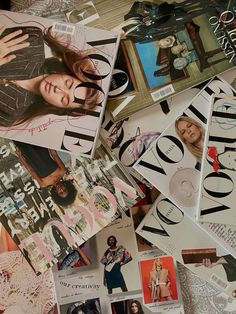 many magazine covers are piled on top of each other