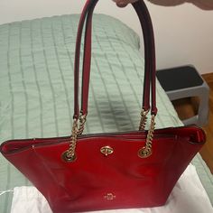 Beautiful Coach Handbag. Used A Few Times. Excellent Condition. One Pocket Outside, 2 Inside Pockets, One Inside Zip Pocket. Hand Leather And Gold Chain. Red Coach Satchel, Chic Red Coach Bag, Elegant Red Coach Shoulder Bag, Red Coach Evening Bag, Coach Red Evening Bag, Red Shoulder Bag With Gold-tone Hardware For Everyday Use, Coach Red Shoulder Bag For Everyday, Coach Red Double Handle Bag, Red Coach Bag For Daily Use