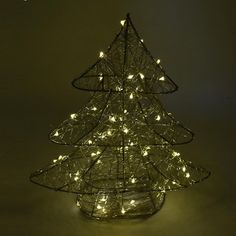 Start off your Christmas decorations with this free standing 3D Metal Wire Christmas Tree! Ready to decorate however you want and will surely brighten your Christmas this season! The lights are always flashing and warm light color and will dazzle you every time you turn it on.Height: 12" Length: 10.5" Width: 3" Pre Lit Metal Christmas Tree, Metal Christmas Tree Lights Outdoor, Large Punched Metal Christmas Star And Christmas Tree Display, Wire Christmas Tree Michaels Stores, Metal Christmas Tree Porch, Pipe Christmas Tree Metal, Wire Christmas Tree, Lead Metal, Fall Ribbons