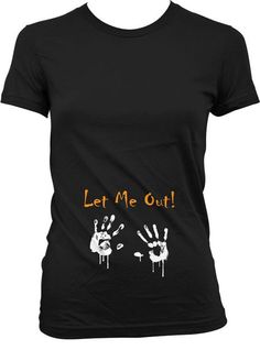 a black shirt that says let me out with two hands painted on it and the words,