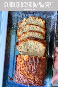 a loaf of sourdough biscard banana bread on a blue tray with text overlay