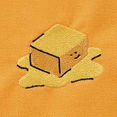 a piece of toaster bread on an orange shirt