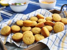 some muffins are on a blue and white towel