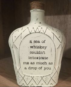 a bottle that is sitting on a shelf with some writing on it's side