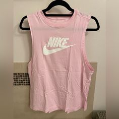 Brand New, Never Worn Nike Tank Nike Casual Tank Top For Summer, Nike Casual Pink Tank Top, Casual Nike Pink Tank Top, Casual Pink Nike Tank Top, Nike Sleeveless Go-dry Tank Top, Nike Moisture-wicking Workout Tank Top, Nike Moisture-wicking Tank Top, Pink Moisture-wicking Tank Top For Sportswear, Nike Tank