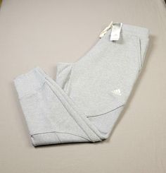 ADIDAS Mens Jogger Pants Studio Lounge Internal Cuffed Tapered Sweatpants Gray White Large BRAND NEW WITH TAGS COLOR: GRAY WHITE MEN'S SIZE LARGE Waist Across: 16.5 inches Length: 41 inches Inseam: 28 inches 2XL Waist: 19 inches ( across ) Length: 41 inches Inseam: 28 inches Shipped with USPS Priority Mail except on weekends & holidays Please note USPS is experiencing an increase in packages. Delivery times may take longer than normal. Studio Lounge, Tapered Sweatpants, Athletic Clothes, Mens Jogger Pants, White Fleece, Adidas Mens, Fleece Sweatpants, Pants Large, Active Wear Pants