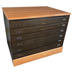 an old wooden file cabinet with five drawers