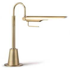 a gold sink faucet with an angled arm and one light on the side