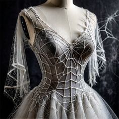 a mannequin wearing a dress made out of spiderweaves and netting