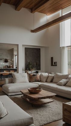 a living room filled with lots of white furniture