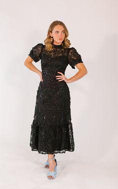 + solid black color+ intricate lace detailing + subtle sequins throughout+ mock neckline+ button closure at sleeves+ mid-axi length with tiered hem Western Dress Patterns, Formal Dresses With Sleeves, Modest Wedding, Lace Dresses, Lace Dress Black, Mock Neckline, Puffed Sleeves Dress, Work Wardrobe, Western Dresses