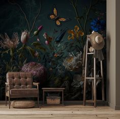 a living room with a chair and wall mural