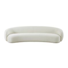 a white couch sitting on top of a white floor