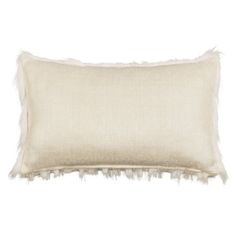 a white pillow with fringes on the front and back, sitting against a white background