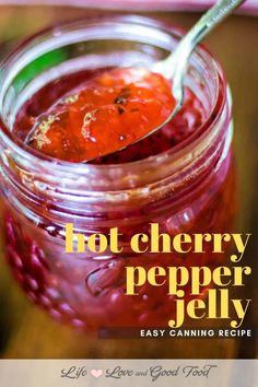 a jar filled with jelly sitting on top of a table