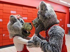 two people dressed in animal costumes dance together