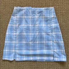 Super Soft Blue Plaid Print Skirt With A Side Zipper Opening, A Slight Stretch Waistband, And Two Small Front Slits. Fabrics: 64% Polyester, 34% Viscose, 2% Spandex Measurements: 16" Length, 24" Waist Made In: China Nwot Summer Pencil Skirt With Split Design, Split Design Pencil Skirt For Summer, Casual Pencil Skirt With Split Design, Blue Split Skirt For Spring, Spring Blue Split Skirt, Blue Pencil Skirt Skort For Spring, Trendy Blue Stretch Skort, Blue Pencil Skirt Lined Skort, Blue Pencil Skirt Skort For Summer