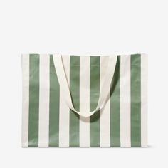 a green and white striped shopping bag