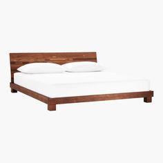 a wooden bed frame with white sheets and pillows on it, against a white background