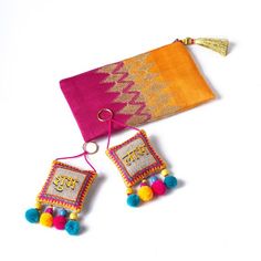 DIWALI GIFT PACKEmbroidered Silk Party clutchPair of Handmade SHUBH-LABH tassels'Gift wrapping' available to send these gifts to your loved ones.Pick a combo pack from VLiving's range of Diwali gifts to someone you love.We have taken away the stress of choosing and figuring out a gift and made it easy for you to simply pick a set and give a gift that is unique, handmade & stylish.CLUTCH -  Embroidered silk party clutch/purseSHUBH LABH tassels - great gift accompaniment for any Indian Festiva Festive Gold Bag With Tassels, Festive Celebration Bags With Tassels, Festival Bags With Tassels As Gifts, Rectangular Tasseled Clutch As Gift, Diwali Gift Packs, Silk Clutch, Diwali Rangoli, India Gift, Bag Designs