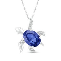 Casual and cute, this blue lab-created sapphire and diamond accent tilted sea turtle pendant captures your lively personality. Crafted in sterling silver This tilted sea turtle design features an 8.0 x 6.0mm oval-shaped bright blue lab-created sapphire as the body. Dainty diamond accents and beaded details adorn the feet for added shimmer and texture. The pendant suspends slightly askew along an 18.0-inch rope chain that secures with a spring-ring clasp. Elegant Sterling Silver Turtle Jewelry, Sea Turtle Design, Turtle Ring, Italy Jewelry, Diamond Wallpaper, Peoples Jewellers, Turtle Design, Turtle Pendant, Elegant Tattoos