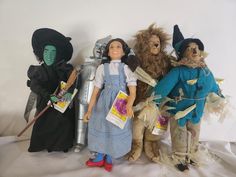 three wizard dolls standing next to each other