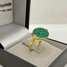 14k yellow gold special signet ring with a beautiful natural malachite engraved with a winged angel in love.  Malachite is known as the stone of transformation, it inspires you to push yourself beyond your comfort zone and gives you the strength to do so.  Dimensions of the green gemstone: 13.0 * 17.0 mm. / 0.51 * 0.67 inch.  Ring size : 53.0 FR. This ring can be made in our workshop at any size. 14k yellow gold chevalier and not only ring with carved natural vivid green gemstone showing a love Luxury Green 14k Gold Signet Ring, Luxury Signet Ring With May Birthstone For Gift, Luxury Signet Ring For May Birthstone Gift, Yellow Gold Emerald Signet Ring Gift, Green 14k Stamped Signet Ring As Gift, Green 14k Stamped Signet Ring, Perfect For Gifts, Gift Green Signet Ring Stamped 14k, Gift Green 14k Stamped Signet Ring, Gold Emerald Signet Ring Gift