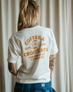 Coffee & Croissants White | Women's Graphic T-Shirts – P&Co USA French T Shirts Graphic Tees, Coffee Shop Tshirts, Staff Shirt Design, Cafe Tshirt Design, Merchandise Ideas Clothing, Merchandise Design Ideas, Coffee Shop T Shirt, Coffee Shop Merchandise, Coffee Shirt Ideas