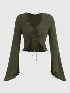 a cropped top with ruffles on the shoulders and an open neckline