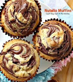 three chocolate cupcakes on a plate with the title nutella muffins can't stay out of the kitchen