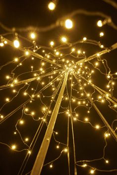 an overhead view of some lights in the night sky with no one around them or on the ground