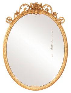 an ornately decorated gold mirror on a white background