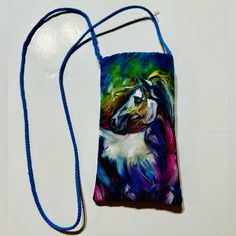 Designer Hand Painted Silk Crossbody Phone Glasses Pouch Bag Crossbody New The Crossbody Phone Pouch Is The Perfect Solution To Those Needing Quick Access To Their Phone, Credit/Debit Card And Other Small Items One Doesn't Want To Dig Around For. Sized To Fit Most Phones And Includes A Card Pocket On The Exterior. Drawstring To Fit To Ones Ideal Length And Can Even Be Cinched And Tied To Wear Around Your Waist! Measures 3.5” W X 6” H Drawstring Strap 33.5” Outside Card Pocket Blue Shoulder Phone Bag For On-the-go, Blue Rectangular Phone Bag With Removable Pouch, Blue Phone Bag With Adjustable Strap For On-the-go, Blue Travel Pouch For Mobile Phone, Blue Mobile Phone Pouch For Travel, Blue Mobile Phone Travel Pouch, Blue Phone Bag With Removable Pouch For Daily Use, Blue Phone Bag With Cell Phone Pocket For On-the-go, Blue Shoulder Phone Bag With Removable Pouch