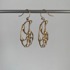 These nautical earrings give the feel of riding shining, golden waves. 14k yellow gold Ammonites measure 1" x 1 1/4" Earrings hang 1 7/16" from the ear Each earring weighs 4.1g 4 Earrings, Nautical Earrings, Newport Ri, Newport, Nautical, Fine Jewelry, Yellow Gold, Sculpture, Yellow