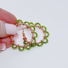 Beautiful Green Seed Beads were carefully wrapped around rose gold hoops with rose gold wire.  These, beautiful, hoop earrings are in 30mm (1 inch) diameter. (Please see the pictures that include a tape measure and a quarter for size reference.)  These earrings will quickly elevate any outfit! Cotton Filled Box Included. Handmade in the USA. --------  Find more Beautiful Pieces at AshbeesAccessories 🛍 Shop: https://www.etsy.com/shop/AshbeesAccessories Necklaces: https://www.etsy.com/shop/Ashbee Rose Gold Wire Wrapped Hoop Earrings, Rose Gold Beads, Beaded Hoop Earrings, Beaded Hoops, Gold Wire, Gold Hoops, Jewelry Inspo, Jewelry Earrings Hoops, Seed Beads