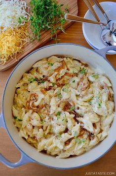 a bowl of macaroni and cheese on a wooden table