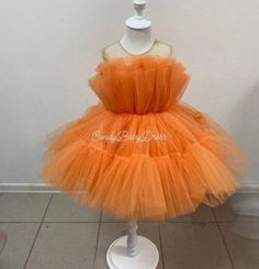 All dresses are made as mother and daughter Please ask for color option. The dress is made in 1 or 2 day. This Luxury Orange Puffy Dress is completely made of health-safe and kid-friendly materials. Inner parts are 100% cotton and outer parts are sewed with high quality sequin and tulle. Dress is made to order in any size. If you want it to fit perfectly, please, send me the measurements of your daughter and I will sew the dress according to the measurements. Please follow the page. Take care of Orange Puffy Dress, Orange Tulle Party Dress, Orange Tulle Dress For Party, Orange Tulle Tutu Party Dress, Orange Tulle Tutu Dress For Party, First Birthday Tulle Tutu Dress With Ruffles, Orange Summer Party Tutu Dress, Cute Ruffled Tutu Dress For Pageant, Sequin And Tulle Dress