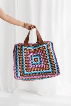 This stunning weekend bag is the perfect blend of craftsmanship and elegance. Featuring a large hand-crocheted design and a soft cotton lining, it offers both style and comfort for everyday use. 🌱 This beautiful bag features: Handmade: Each bag is meticulously and lovingly handcrafted. Crocheted Design:Elegant and durable hand-crocheted pattern. Linen Lining:Soft and durable linen lining to protect your belongings. Leather Strap: Sturdy leather straps complete the bag's chic look. Versatile Use Multicolor Double Handle Crochet Bag With Large Capacity, Everyday Multicolor Crochet Bag With Handles, Colorful Crochet Tote Bag For Travel, Multicolor Crochet Travel Bag With Large Capacity, Multicolor Crochet Tote Bag With Handles, Multicolor Crochet Travel Bag With Braided Handles, Multicolor Crochet Tote Bag With Braided Handles, Multicolor Crochet Bag With Braided Handles For Travel, Multicolor Large Capacity Crochet Travel Bag