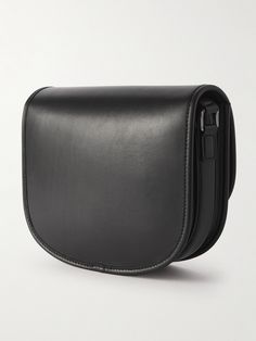 CELINE HOMME's messenger bag is crafted from smooth black leather in a saddle shape. It has plenty of compartments to keep your essentials organised and features the house's heritage 'Triomphe' plaque at the front. Adjust the strap to best suit your height. Timeless Black Satchel Saddle Bag, Timeless Black Saddle Bag For Travel, Timeless Black Saddle Bag For Formal Occasions, Timeless Black Saddle Shoulder Bag, Timeless Black Saddle Bag For Business, Modern Black Saddle Bag With Leather Lining, Classic Black Saddle Bag For Work, Classic Black Saddle Bag For Office, Classic Black Leather Saddle Bag