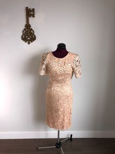 Leslie Fay Evenings - Vintage peach / gold, lace, evening dress.  Beautiful, classic lace dress, in a soft peach color, with gold accents.  Perfect for any evening occasion, or fancy daytime event!   Size 6 (or 4) For every item purchased, an item will be donated. Gold Party Dress, Vintage Dresses 1960s, 1960s Dress, Gold Brocade, Lace Dress Vintage, Satin Long Sleeve, 1960's Dress, 1980s Dresses, Lace Evening Dresses