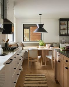 Before + After: This kitchen + dining remodel stuns with a total refresh, featuring our Anello Pendant—the perfect statement light to illuminate a dining nook. What's the first piece you need for your new year kitchen project? Design by @staffordhousestudio, photo by @lomillerphoto, styling by @_meandmo_, build by @marmocontracting