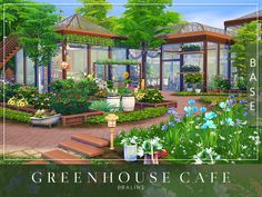 the green house cafe is surrounded by flowers and plants