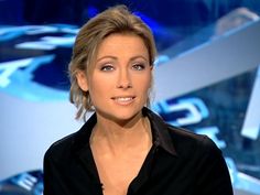 a woman is sitting down and talking on the set of an abc news program,