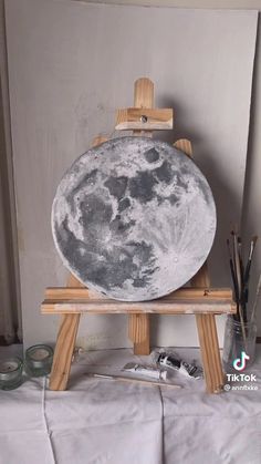 an easel with a large moon on it