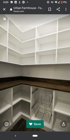 an empty pantry with white shelves and wood flooring on the bottom shelf is shown